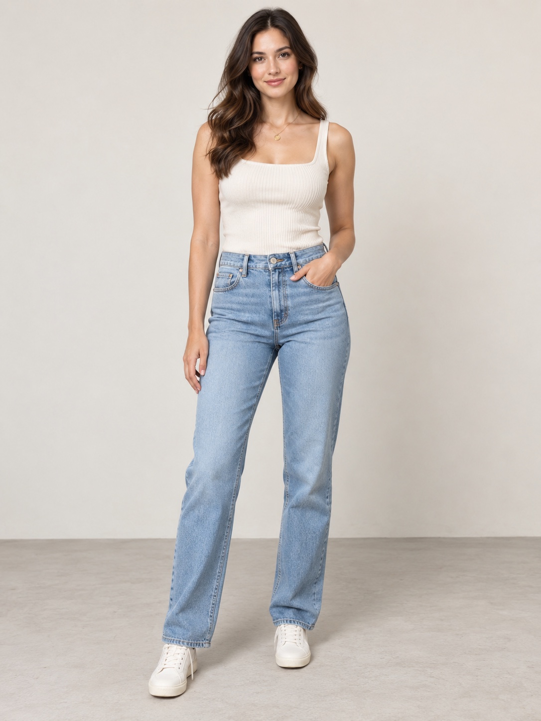The uploaded photo: a woman in a white tank top and blue jeans, standing in a plain room